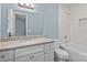 Bright bathroom featuring modern vanity with granite countertops and tiled shower over tub at 1195 Ralph B Keener Rd, Lincolnton, NC 28092