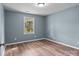 Inviting bedroom with new floors, fresh paint, natural light, and an electrical outlet at 1195 Ralph B Keener Rd, Lincolnton, NC 28092