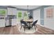 Dining area features new flooring and trim, with white cabinets and stainless steel appliances nearby at 1195 Ralph B Keener Rd, Lincolnton, NC 28092