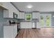 Bright kitchen with white cabinetry, stainless steel appliances, and granite countertops at 1195 Ralph B Keener Rd, Lincolnton, NC 28092