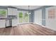 Bright kitchen area with new flooring, trim, white cabinets, stainless steel appliances and access to the yard at 1195 Ralph B Keener Rd, Lincolnton, NC 28092