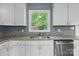 Bright kitchen with stainless steel appliances, white cabinets, and granite countertops near a window view at 1195 Ralph B Keener Rd, Lincolnton, NC 28092