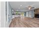Open-concept living room features a stone fireplace and ample natural light at 1195 Ralph B Keener Rd, Lincolnton, NC 28092