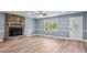 Comfortable living room featuring a stone fireplace and a large window at 1195 Ralph B Keener Rd, Lincolnton, NC 28092