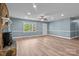 Spacious and bright living room featuring wood-look floors, a stone fireplace, and ample natural light at 1195 Ralph B Keener Rd, Lincolnton, NC 28092