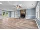 Spacious living room featuring a stone fireplace and access to the outdoors at 1195 Ralph B Keener Rd, Lincolnton, NC 28092