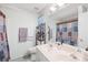 This serene bathroom boasts a dual sink vanity, and a shower/tub combination with a neutral color scheme at 12305 Portrush Ln, Charlotte, NC 28273