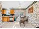 Cozy dining area with a ceiling fan and view of the backyard at 12305 Portrush Ln, Charlotte, NC 28273