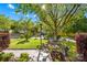 The front yard is well maintained with mature trees and a lovely garden at 12305 Portrush Ln, Charlotte, NC 28273