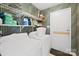 The laundry room features a washer and dryer on risers and plenty of storage at 12305 Portrush Ln, Charlotte, NC 28273