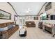 Cozy living room with tile flooring, a ceiling fan, and a decorative fireplace at 12305 Portrush Ln, Charlotte, NC 28273