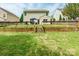Backyard with grassy area, fence, and patio at 13015 Rothe House Rd, Charlotte, NC 28273