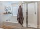 Bright bathroom features a tub, shower, and stylish decor at 13015 Rothe House Rd, Charlotte, NC 28273