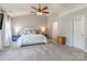 Spacious bedroom with modern furniture, neutral walls and bright natural light at 13015 Rothe House Rd, Charlotte, NC 28273
