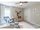 Serene Bedroom with neutral tones, a crib, and a cozy chair at 13015 Rothe House Rd, Charlotte, NC 28273