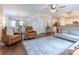 Spacious living room with hardwood floors, fireplace, and an open floor plan leading to the dining area and kitchen at 13015 Rothe House Rd, Charlotte, NC 28273