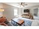 Comfortable living room with modern furniture, and bright natural light at 13015 Rothe House Rd, Charlotte, NC 28273