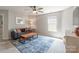 Relaxing living room with a comfortable couch, area rug, and bright natural light at 13015 Rothe House Rd, Charlotte, NC 28273