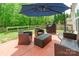 Outdoor patio area with comfortable seating and a grill for entertaining at 13015 Rothe House Rd, Charlotte, NC 28273