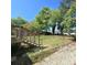 View of wooden deck and backyard, which includes a chain link fence for containment at 1307 Washington Ln, Kannapolis, NC 28083