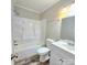 Bright bathroom with a shower-tub combination and single sink vanity at 1307 Washington Ln, Kannapolis, NC 28083