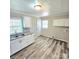 The kitchen features granite countertops, stainless steel sink, and white cabinets at 1307 Washington Ln, Kannapolis, NC 28083