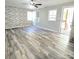 Bright and airy living room with modern flooring, ample natural light, and neutral wall colors at 1307 Washington Ln, Kannapolis, NC 28083