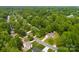 Lovely aerial view of the neighborhood with mature trees and well-maintained homes at 13324 Kintyre Ct, Matthews, NC 28105