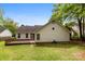 Back exterior of home with siding, windows, sliding glass doors and a wooden deck at 13324 Kintyre Ct, Matthews, NC 28105