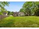 A large backyard and deck on a sunny day at 13324 Kintyre Ct, Matthews, NC 28105