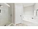 Relaxing bathroom features a stand-alone shower with glass enclosure and a large soaking tub at 13324 Kintyre Ct, Matthews, NC 28105