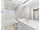 Bathroom with nice tile, large mirror, tub and shower combo at 13324 Kintyre Ct, Matthews, NC 28105