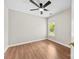 Bedroom featuring hardwood floors, neutral paint, and a ceiling fan at 13324 Kintyre Ct, Matthews, NC 28105