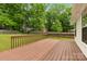 A backyard deck with railing overlooking a large yard at 13324 Kintyre Ct, Matthews, NC 28105