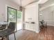 Bright dining area features modern lighting, a convenient coffee bar, and deck access through sliding glass doors at 13324 Kintyre Ct, Matthews, NC 28105