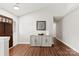 Entryway with wood floors, stylish cabinet, decorative accents, and lots of light at 13324 Kintyre Ct, Matthews, NC 28105