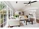 Bright living room with hardwood floors flowing into the kitchen area with an open, airy feel at 13324 Kintyre Ct, Matthews, NC 28105