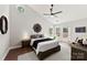Large main bedroom with vaulted ceilings, a ceiling fan, and a private entrance to a wooden deck at 13324 Kintyre Ct, Matthews, NC 28105
