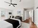 Main bedroom features vaulted ceilings, a ceiling fan, private access to the deck, and a large dresser at 13324 Kintyre Ct, Matthews, NC 28105