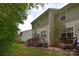 Exterior view of home featuring back decks, grassy yard, and lush greenery at 139 High Ridge Rd, Mooresville, NC 28117