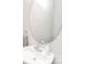 Well-lit half bath featuring an oval mirror, modern faucet, and a white sink at 139 High Ridge Rd, Mooresville, NC 28117