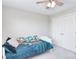 Bright bedroom with light gray walls, ceiling fan, and plush carpet featuring a bed at 139 High Ridge Rd, Mooresville, NC 28117
