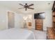 Neutral bedroom with gray walls, ceiling fan, and a wooden dresser at 139 High Ridge Rd, Mooresville, NC 28117