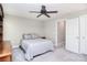 Neutral bedroom with gray walls and gray comforter and brown ceiling fan at 139 High Ridge Rd, Mooresville, NC 28117