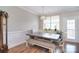 Bright dining area featuring wood floors, wainscotting, and natural light at 139 High Ridge Rd, Mooresville, NC 28117