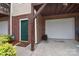 Exterior view of the home with a garage door and a green front door with a brick facade at 139 High Ridge Rd, Mooresville, NC 28117