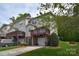 View of the side of the townhome featuring a private porch and garage at 139 High Ridge Rd, Mooresville, NC 28117