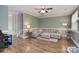 Spacious living room features hardwood floors, grey sofa, and ample natural light at 139 High Ridge Rd, Mooresville, NC 28117