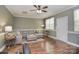 Inviting living room with hardwood floors, crown molding, and a comfortable sofa at 139 High Ridge Rd, Mooresville, NC 28117