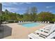 Sparkling community pool surrounded by mature trees with plenty of lounge chairs and outdoor seating at 139 High Ridge Rd, Mooresville, NC 28117